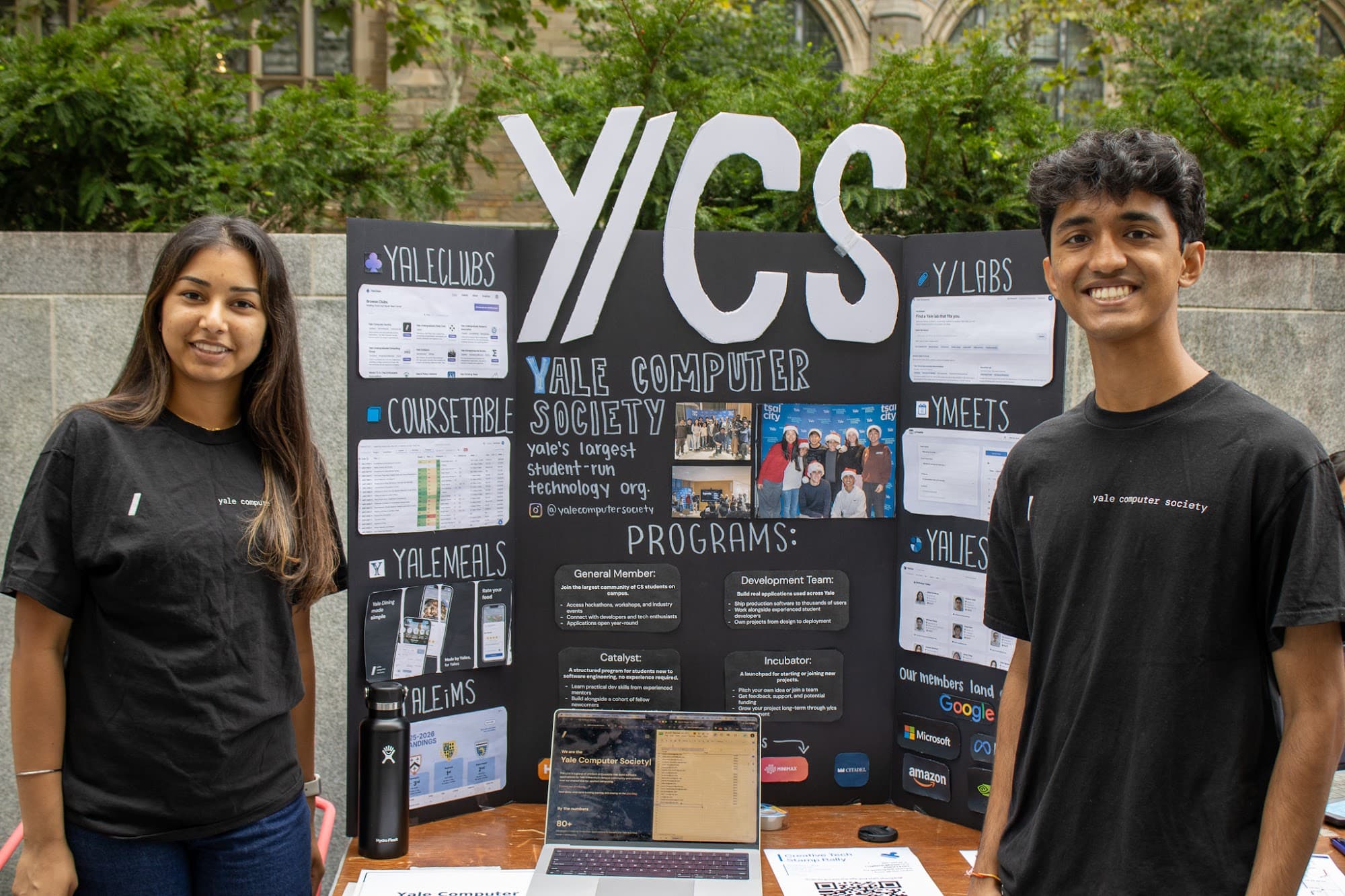 Two members at the y/cs booth at the EC Bazaar