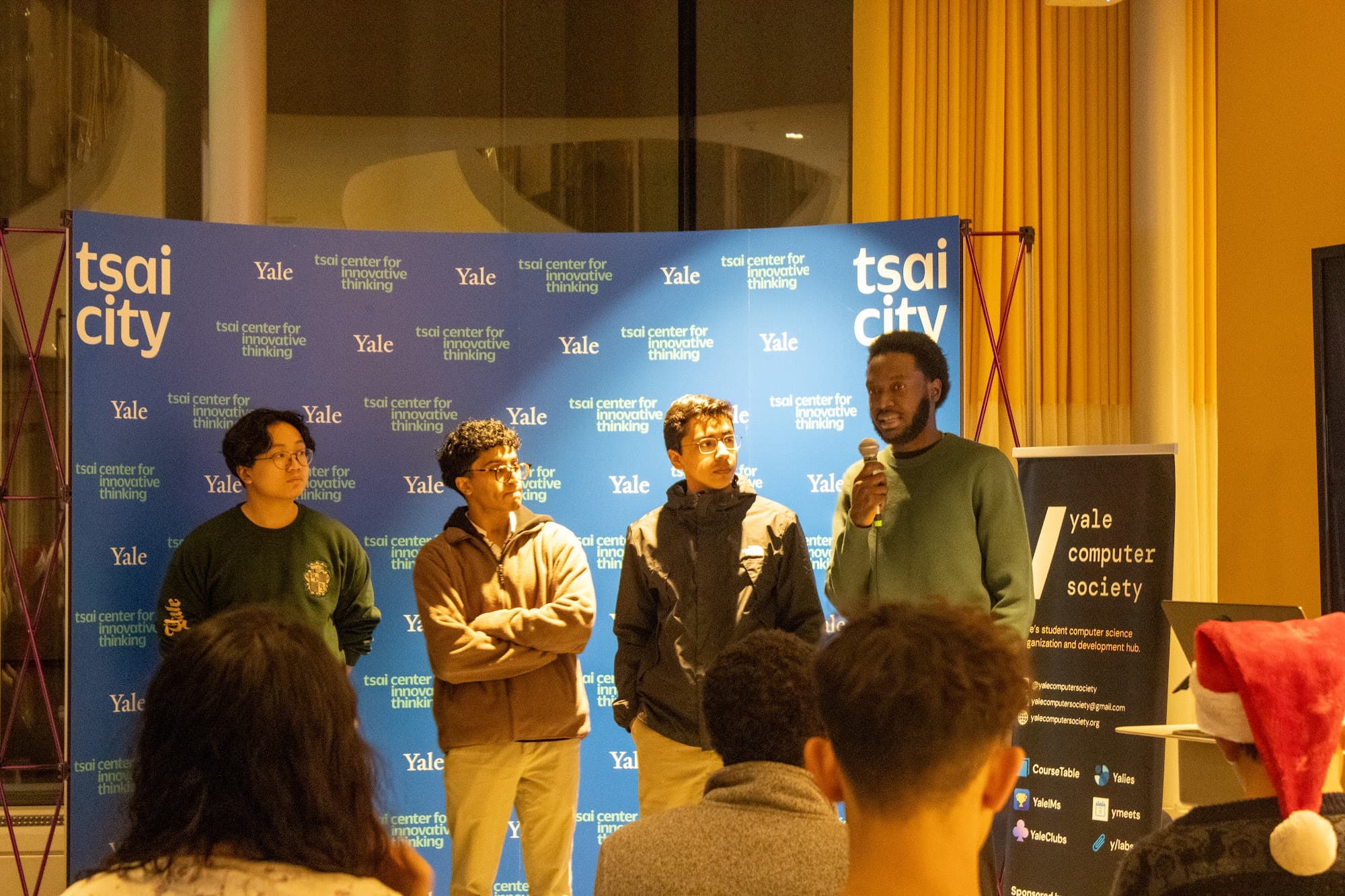 Four team members presenting at Demo Day