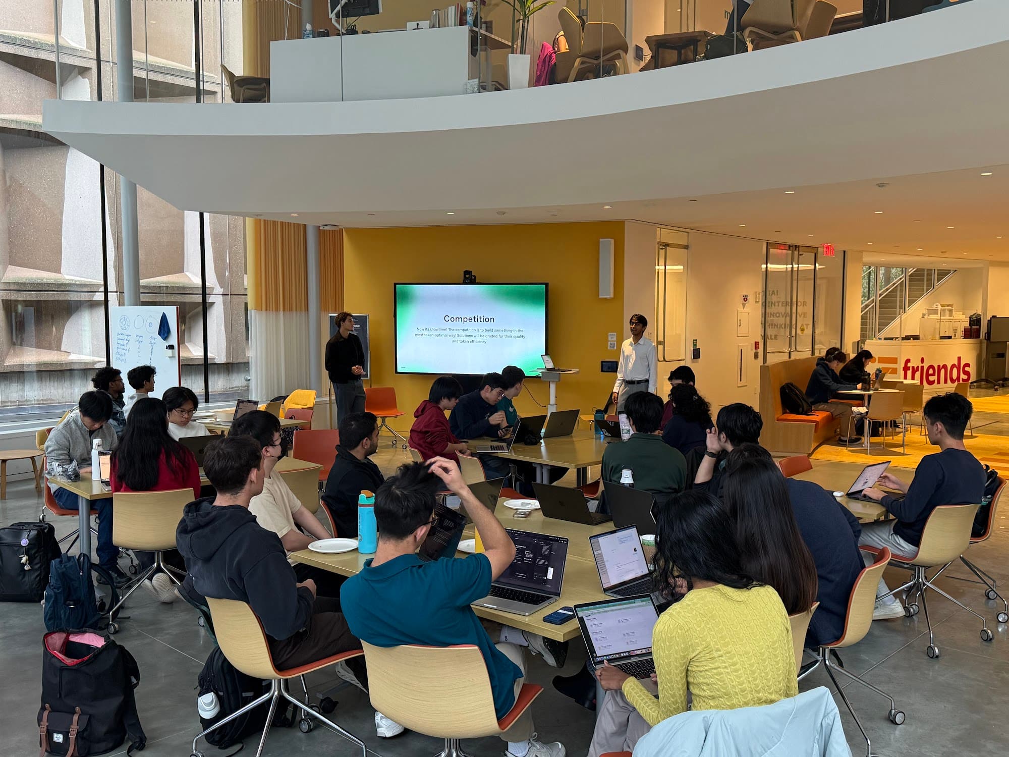 Students working at the OpenAI technical workshop